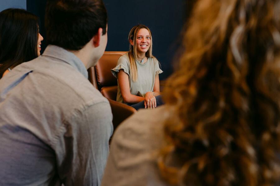 an intercultural studies major discusses with classmates